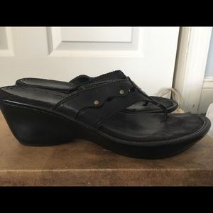 Black leather sandal wedge.